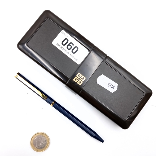 60 - A Givenchy ballpoint pen with gold metal detailing with blue resin body.