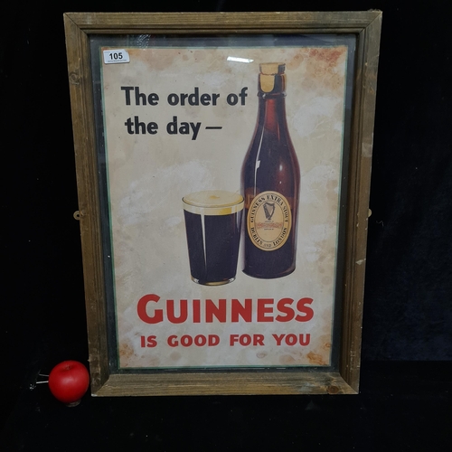 105 - A print of a vintage 1960's advertising poster for Guinness. Housed in a wooden frame behind glass. ... 