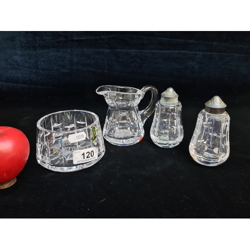 120 - Four Waterford Crystal pieces including a milk jug, a sugar bowl and a salt and pepper shaker. All i... 