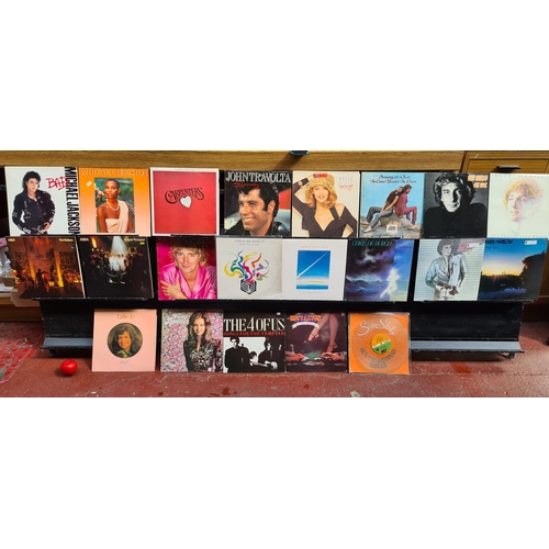 130 - A fantastic lot of 21 pop disco vinyl records from artists such as ABBA, Michael Jackson, The 4 of U... 