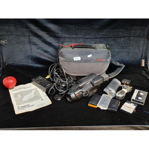 139 - A Canon 8mm UC3000/UC2000 video camcorder in a Pentax carry case. Includes original manual, battery ... 