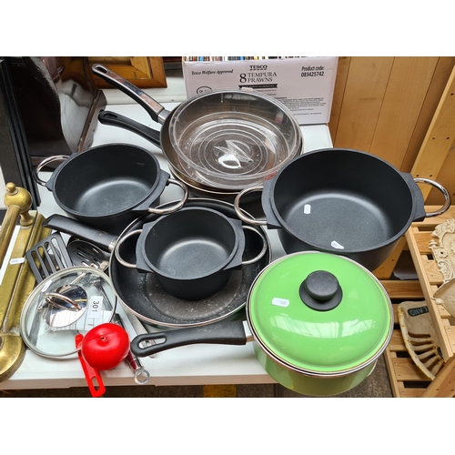 301 - A mixed lot of kitchenware items including graduated Marke Tischfein double handled pots, frying pan... 