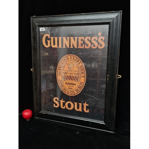 89 - A large print of a vintage Guinness Stout advertising poster. Housed in a black frame behind glass. ... 