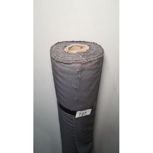 727 - A large roll of grey fabric for furniture reupholstery.