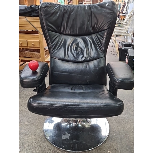 715 - Star Lot : A fabulous vintage Danish Verikon black leather swivel chair with padded armrests and chr... 