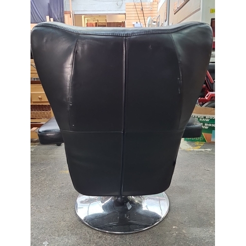 715 - Star Lot : A fabulous vintage Danish Verikon black leather swivel chair with padded armrests and chr... 