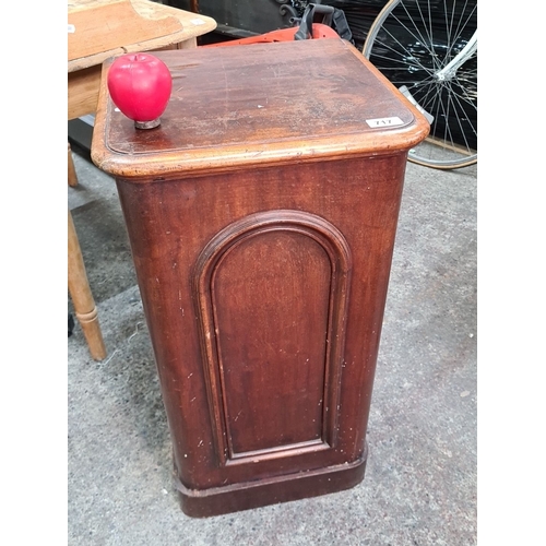 717 - A Victorian red mahogany  pot cupboard with a paneled door. Classic design.