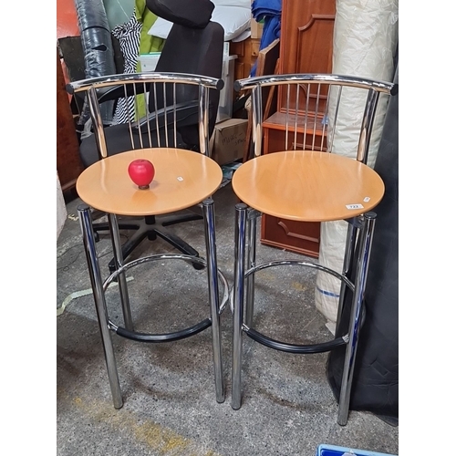 722 - Star Lot :  A pair of Italian Calligaris bar stools made in Italy, featuring stylish chrome frame an... 