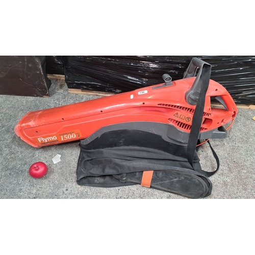 736 - A Flymo GardenVac 1500 Plus. Red and grey garden vacuum with collection bag.