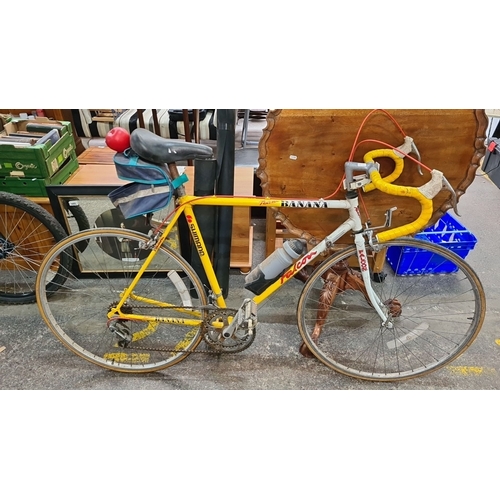 737 - A retro 1991 Falcon Team Banana racing bicycle, featuring Shimano components and vibrant yellow fram... 