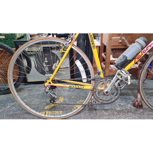 737 - A retro 1991 Falcon Team Banana racing bicycle, featuring Shimano components and vibrant yellow fram... 