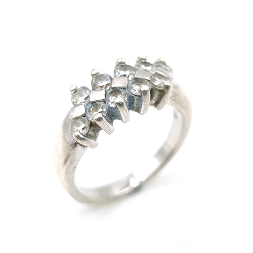 1202 - A sterling silver 925 cluster ring. Ring size R. Total weight 6.6 grams.