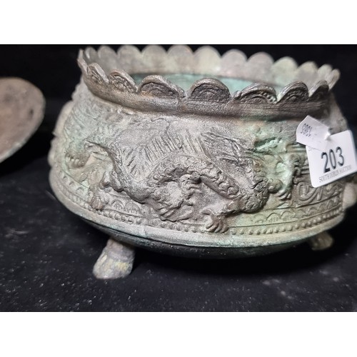 203 - Star Lot : An early antique bronze Chinese footed jar featuring fantastic dragon imagery and embosse... 