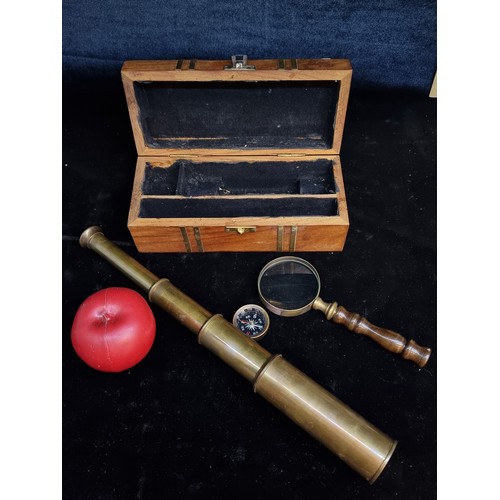 176 - A handsome desktop nautical set including a triple draw spyglass with a compass and magnifying glass... 