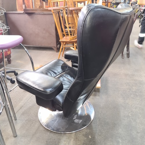 715 - Star Lot : A fabulous vintage Danish Verikon black leather swivel chair with padded armrests and chr... 