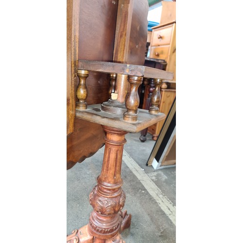 719 - Star Lot : A beautiful Victorian Oak flip top tripod table with scalloped-edge round top and finely ... 