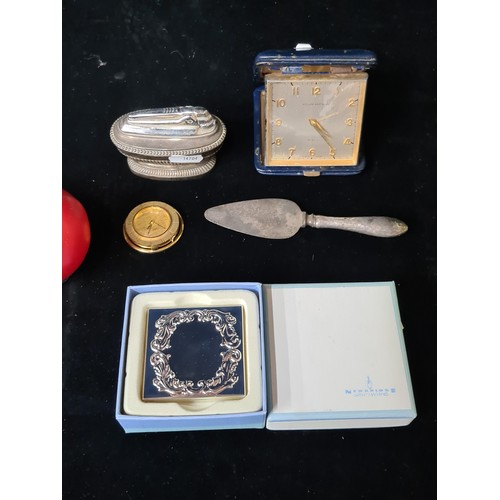 155 - A mixed lot of five items including a silver handled cheese knife, a 'Newbridge' silverware heart sh... 