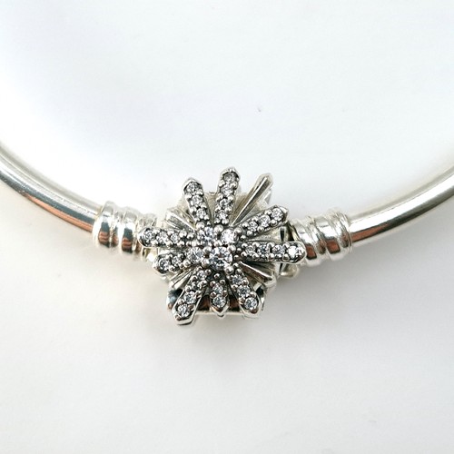 7 - A Pandora silver bracelet with articulated floral clasp. Weight - 10.5 grams. Comes in original Pand... 