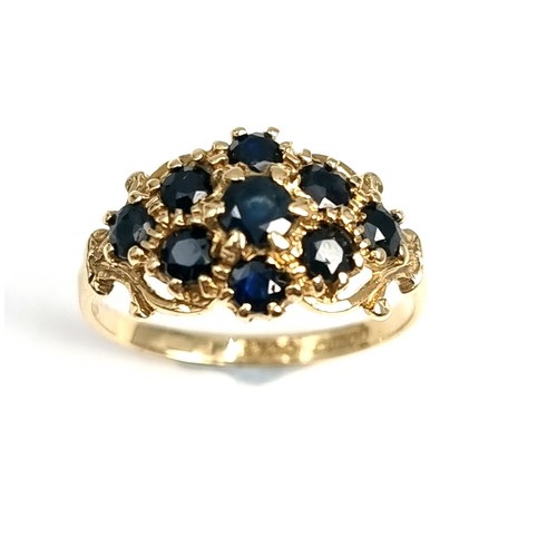 4 - A nine carat gold antique sapphire cluster ring. Weight - 1.9 grams. Size - L.