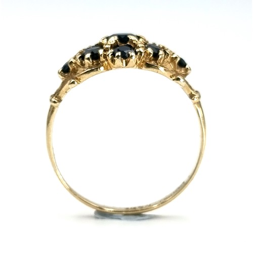 4 - A nine carat gold antique sapphire cluster ring. Weight - 1.9 grams. Size - L.