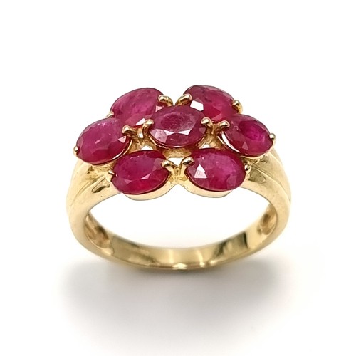 5 - A very fine example of a seven stone ruby ring set in nine carat gold. Weight - 3.5 grams. Size - O.... 