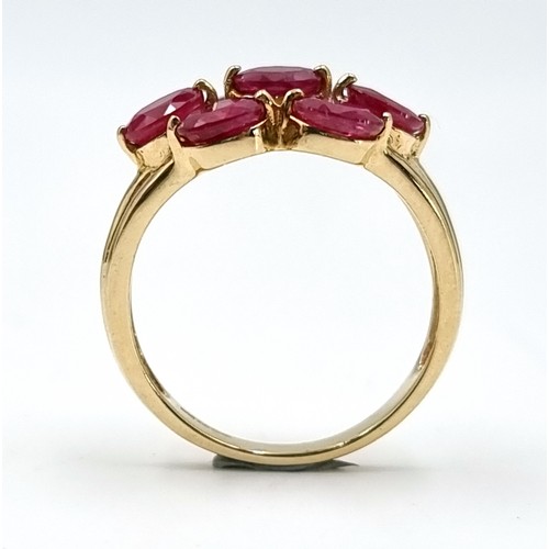 5 - A very fine example of a seven stone ruby ring set in nine carat gold. Weight - 3.5 grams. Size - O.... 