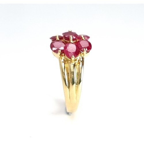 5 - A very fine example of a seven stone ruby ring set in nine carat gold. Weight - 3.5 grams. Size - O.... 