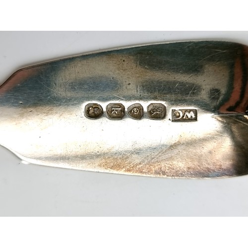 6 - A large George IV silver fish knife dated 1825. Hallmarked London. Weight - 166 grams. Length - 31 c... 