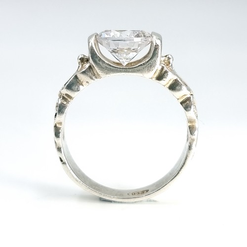 9 - A gem set silver ring marked 925. Weight - 5.4 grams. Size - N 1/2.