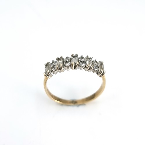 15 - A nine carat gold gem set half eternity ring. Ring size - N. Weight - 1.77 grams.