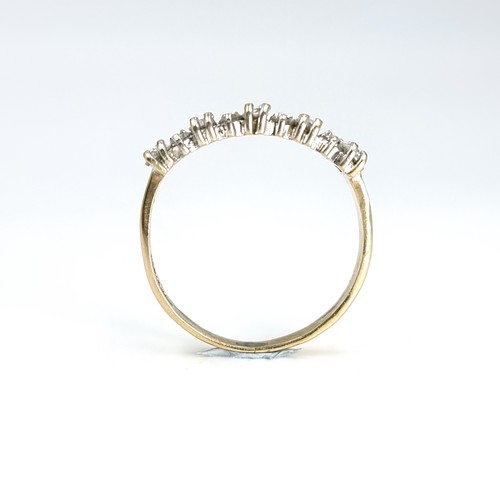 15 - A nine carat gold gem set half eternity ring. Ring size - N. Weight - 1.77 grams.
