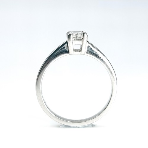 16 - Star lot : An 18 carat white gold diamond solitaire ring. Est. weight of diamond - 0.3 carats. Size ... 