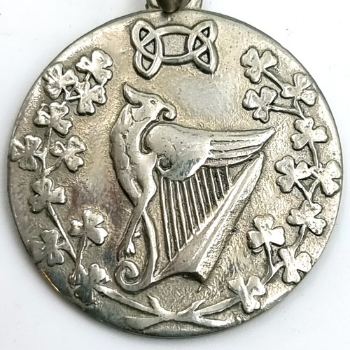 55 - A collection of medallions together with a fob and chain. Items as photographed.