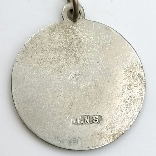 55 - A collection of medallions together with a fob and chain. Items as photographed.