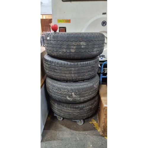 1231 - Star Lot : Four tyres including a pair of Bridgestone Dueler H/T radial tubeless tyres along with a ... 