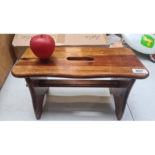 407 - A very sweet wooden stool, handcrafted with a rustic design and a handhold top.