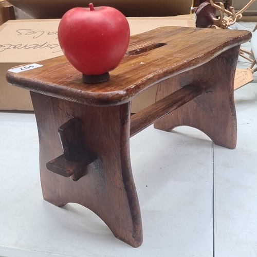 407 - A very sweet wooden stool, handcrafted with a rustic design and a handhold top.