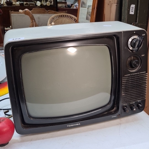 409 - A Vintage Toshiba B1200 12-inch black-and-white television, model B1200. 220V, 50Hz, 33W. Manufactur... 