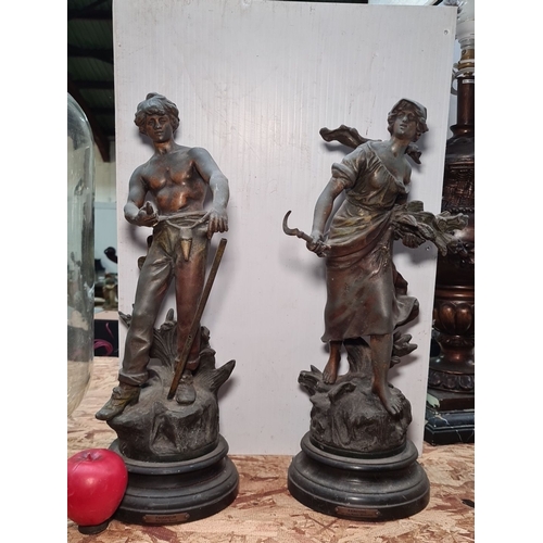 422 - A pair of impressive and large spelter figurative sculptures including 