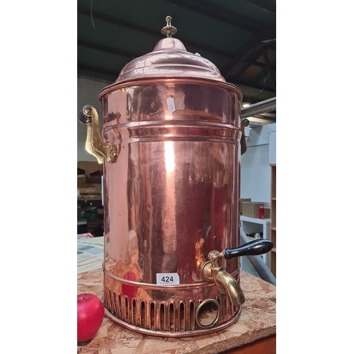 424 - Star Lot : A fabulous large polished copper samovar with brass handles and spigot, featuring a domed... 