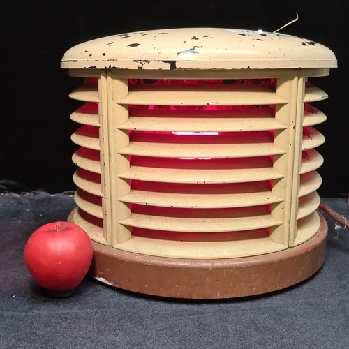 427 - Vintage round electric fan heater with a louvered front grille and exposed rear motor. A retro house... 