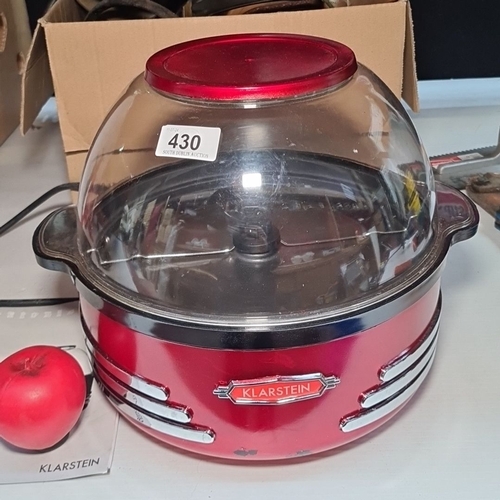 430 - A great looking art deco style Klarstein popcorn machine in red with a clear dome lid. With instruct... 