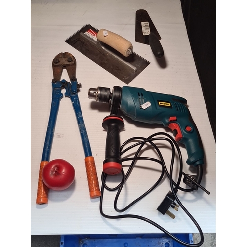 431 - A large box containing a Well-Tool Impact Drill (710W, 230V, 50Hz), bolt cutters, notched trowel and... 