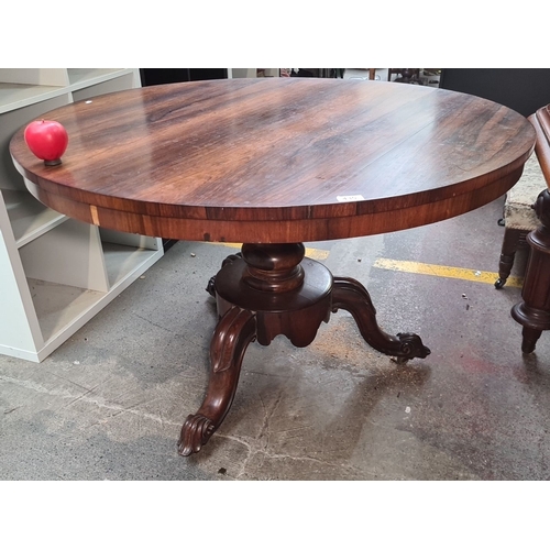 435 - Star lot : A gorgeous Irish Georgian Rosewood pedestal table with a round top and intricately carved... 