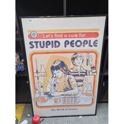 454 - A large humorous poster housed in a black smart frame. MM: 62cm X 93cm 