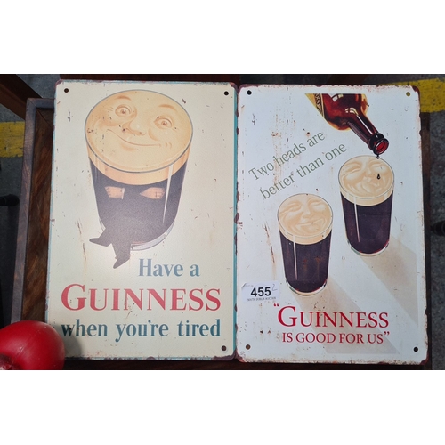 455 - A pair of printed metal, vintage-style Guinness advertising signs.