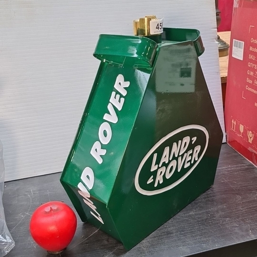 458 - A very cool green metal canister advertising Land Rover, featuring white lettering. The top boasts a... 