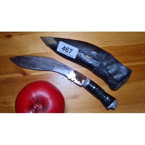 467 - Traditional Kukri Knife. Features a curved blade and a handle with decorative inlays. Comes with a b... 