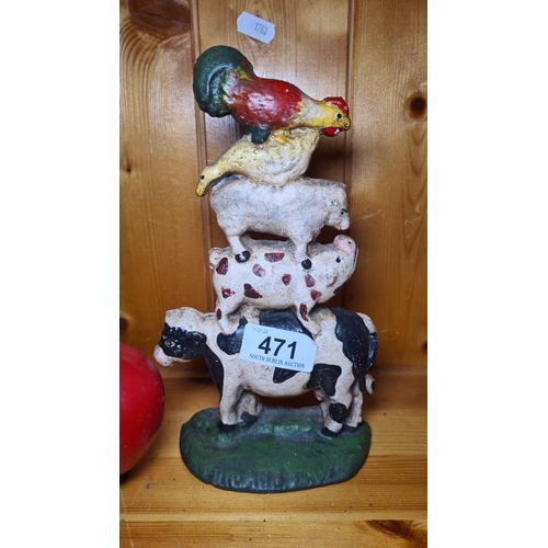 471 - A painted heavy cast iron doorstopper featuring a rooster, sheep, pig, and cow vertically arranged.