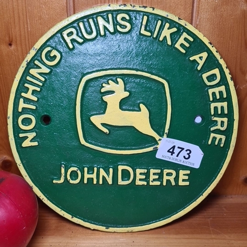 473 - A John Deere heavy cast iron sign. Green and yellow with 